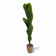 An artificial banana tree with big leaves and a golden basin