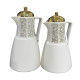 A set of tea and coffee thermoses in several colors with prominent golden decorations and a golden lid.