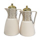 A set of tea and coffee thermoses in several colors with prominent golden decorations and a golden lid.