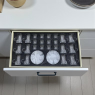 36-piece glass cups and saucers set in various shapes.