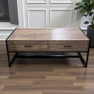 This coffee table features a design combining wood and metal, and includes storage drawers in a dark brown finish.