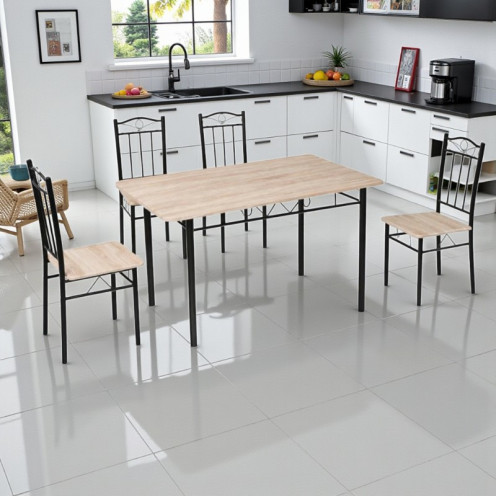 Dining table with four elegant light-colored wooden chairs