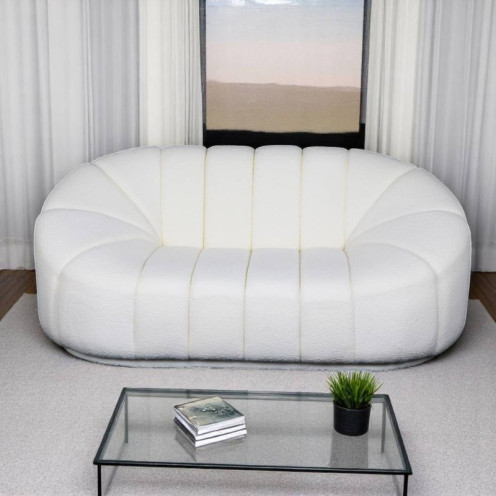A comfortable boucle sofa with a luxurious white wave design.