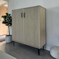 Elegant and sophisticated two-door shoe cabinet with a multi-colored stripe design.