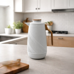 A modern coffee thermos with a distinctive design and an elegant wooden handle, available in several colors.