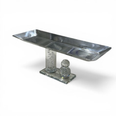 A luxurious hospitality serving dish made of metal (steel) with an acrylic base