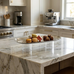 Elegant oval metal serving stand with round acrylic base.