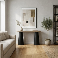A wooden entryway table with luxurious black bases.