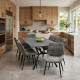 A modern dining table that seats 8, featuring a luxurious ceramic tabletop in various colors.