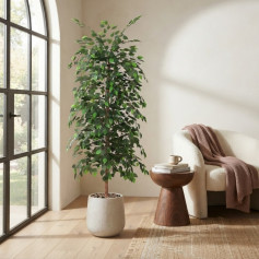 A tall artificial ficus tree with lush green leaves in a light-colored plastic pot.