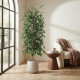 A tall artificial ficus tree with lush green leaves in a light-colored plastic pot.