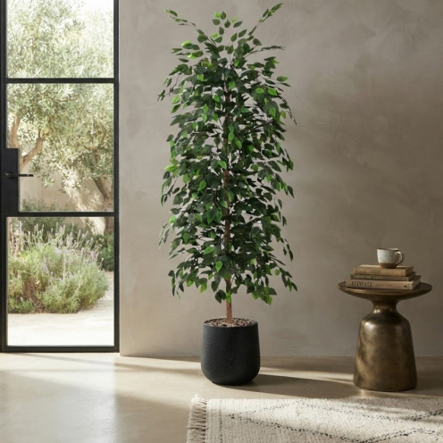 A tall artificial ficus tree with lush green leaves in a black plastic pot.