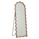 Elegant floor mirror with a luxurious wavy design.