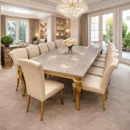 A luxurious, elegant gold marble dining table that seats 12.