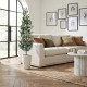 A tall, natural-looking artificial olive tree in a white fiberglass pot.