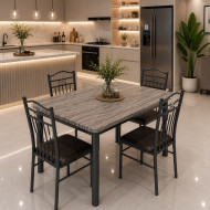 A uniquely colored wooden dining table with a metal frame and four chairs.