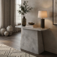 A stylish and high-quality entryway table in gray. This modern and elegant console table features a sleek gray design and a sturdy base with a luxurious stone-like finish.