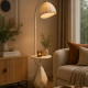 A luxurious beige floor lamp and side table.