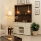 A distinctive, complete coffee corner with storage and stylish decorative lighting - shelves with cup holders in brown and white.
